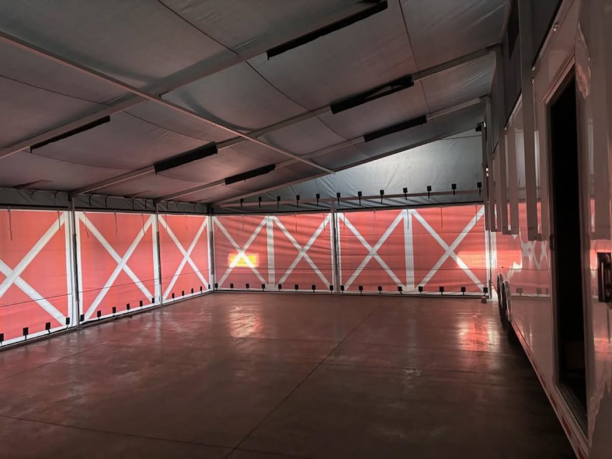 Inside a fully enclosed DMP trailer awning with printed walls